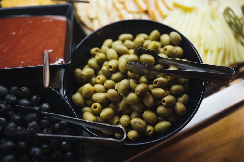 A spread of green and black olives — the makings of muffuletta olive salad