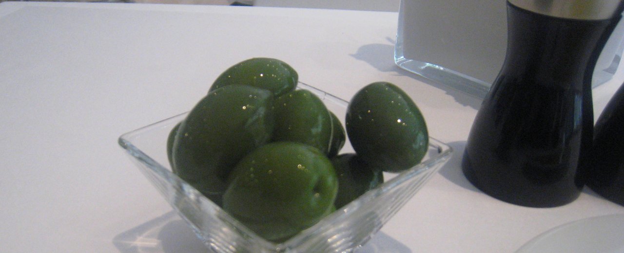 Giant green Bella di Cerignola olives in a dish